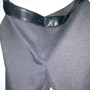 Calvin Klein dress pants never worn. Leather like around the waist line/button